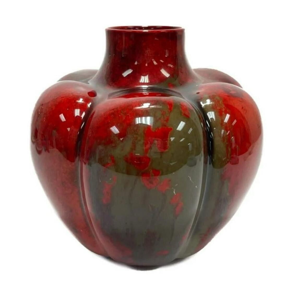 Royal Doulton England Porcelain Flambe Squat Form Vase by Fred Moore circa 1910: Royal Doulton porcelain Flambe squat form vases, circa 1910. Lobed panels with vibrant purple, yellow, green, and blue abstract colors to the bright red base. Faded Royal Doulton mark to the underside