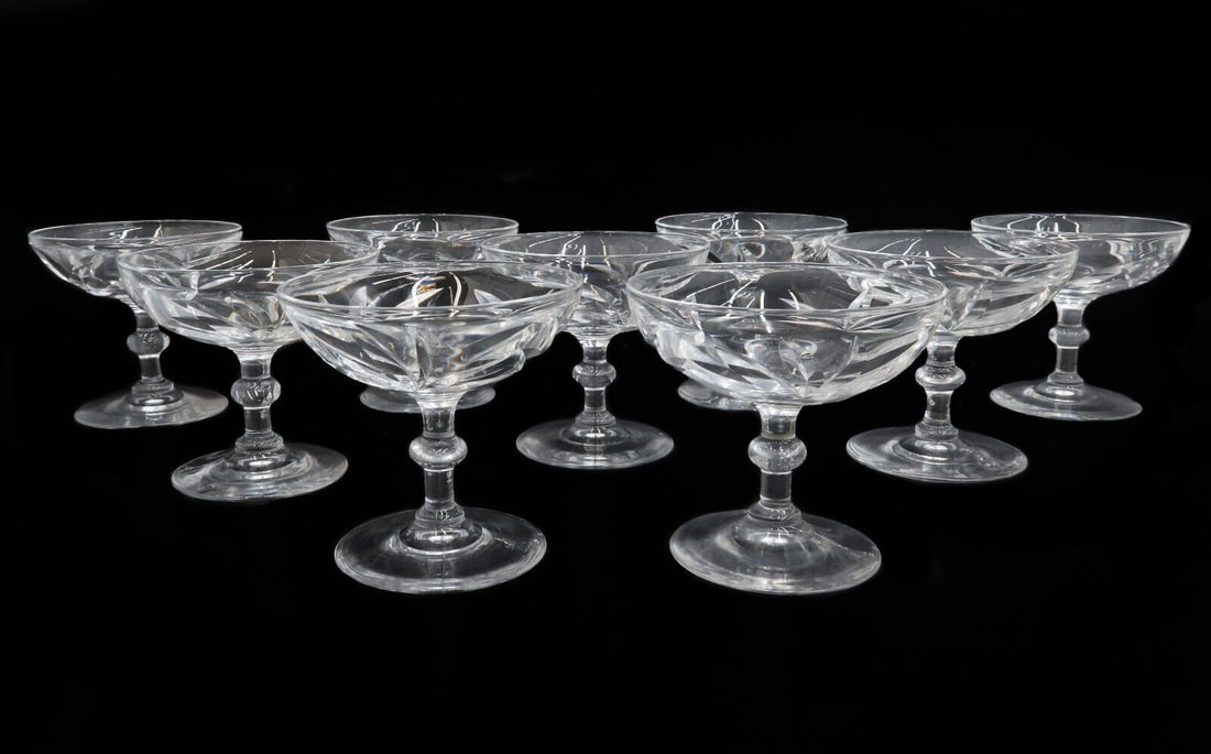9 Steuben Art Glass Champagne Saucers in Leaves Signed: 9 Steuben art glass champagne saucers in Leaves, Signed. Etched leaves throughout body. Marked "S" to underside. Weight: Approx. 10 lbs Measurements: Approx. 4 inches diameter x 3.75 inches tall Condi