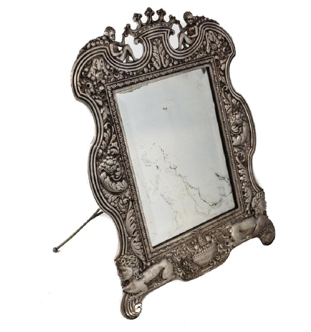 Antique French Silvered Bronze Easel-Back Mirror 19th Century: A fine 19th Century French silvered bronze easel-back mirror with cherubs flanking a crown and sphinx accents. Weight:approx. 9 lbs Measurements: Approx. 23 inches tall x 16.25 inches x 1 inch Conditi