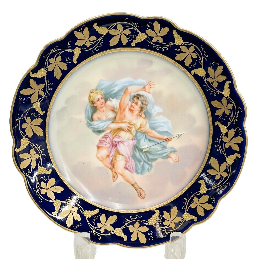 Royal Vienna Austria Hand Painted Porcelain Plate Aurora circa 1920: Royal Vienna Austria Hand Painted Porcelain Plate Aurora, circa 1920. Depicts a classical scene of two figures. A cobalt blue ground to the edge with gilt grapevine decoration, gilt to the scalloped r