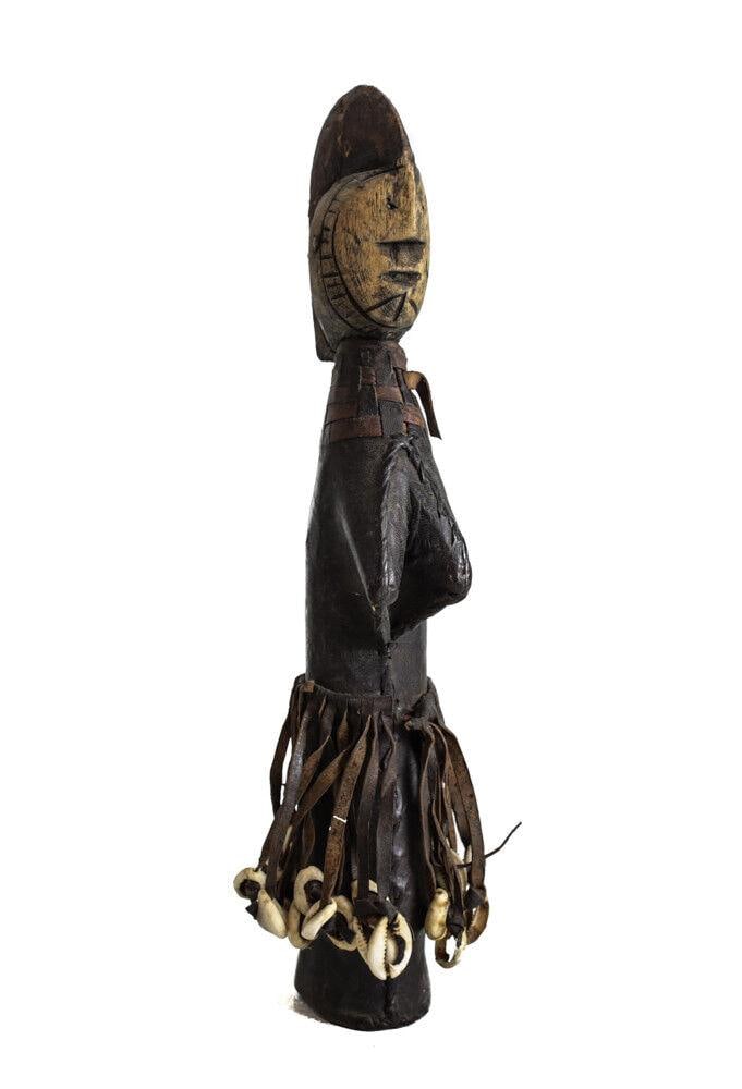 African or Tribal Doll carved wood leather covered body Mossi Belanda Sudan: African Doll, carved wood, leather covered body, Mossi Belanda Sudan fringed leather skirt with cowrie shells. Leather ear ornaments have worn away. 0.5lb Measurements: Approx. 12" height, Condition: