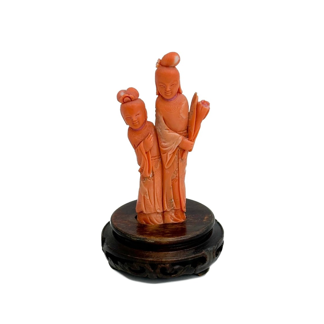 Chinese Carved Coral Figurine on Carved Wood Base: Chinese Carved Coral Figurine with Carved wood base, apparently unmarked. Weight: Approx. 132g total with base Measurements: Approx. Coral: 2.125 inches x .75 inch x 4.25 inches tall / Total with base