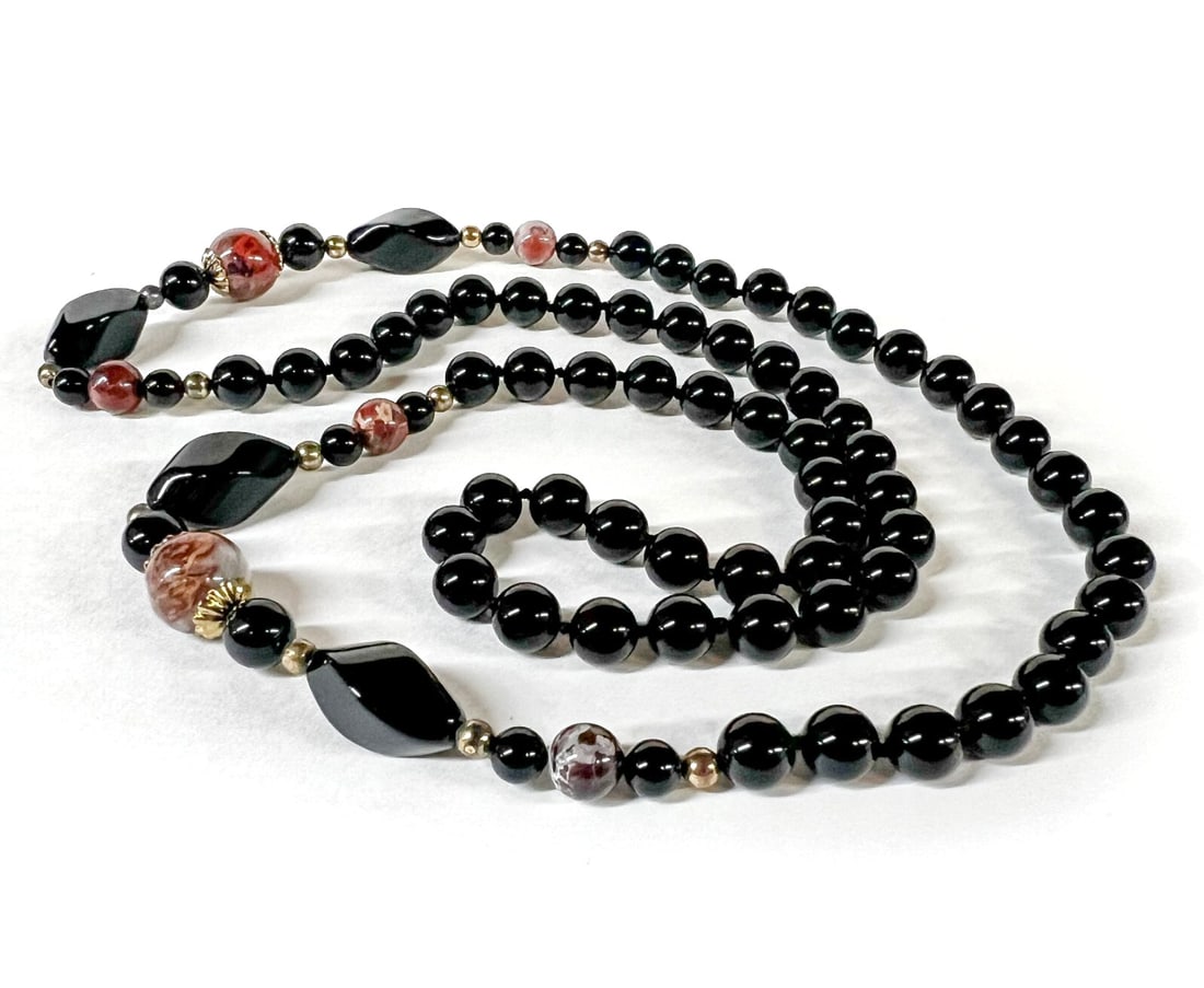 Vintage Onyx and Jasper Continuous Beaded Necklace 28": Onyx and Jasper Continuous Beaded Necklace, with gold toned beads and mounts. Round and twist marquis beads, knotted between the onyx beads. Measurements: Approx. 75.2grams; 32 inches length; largest
