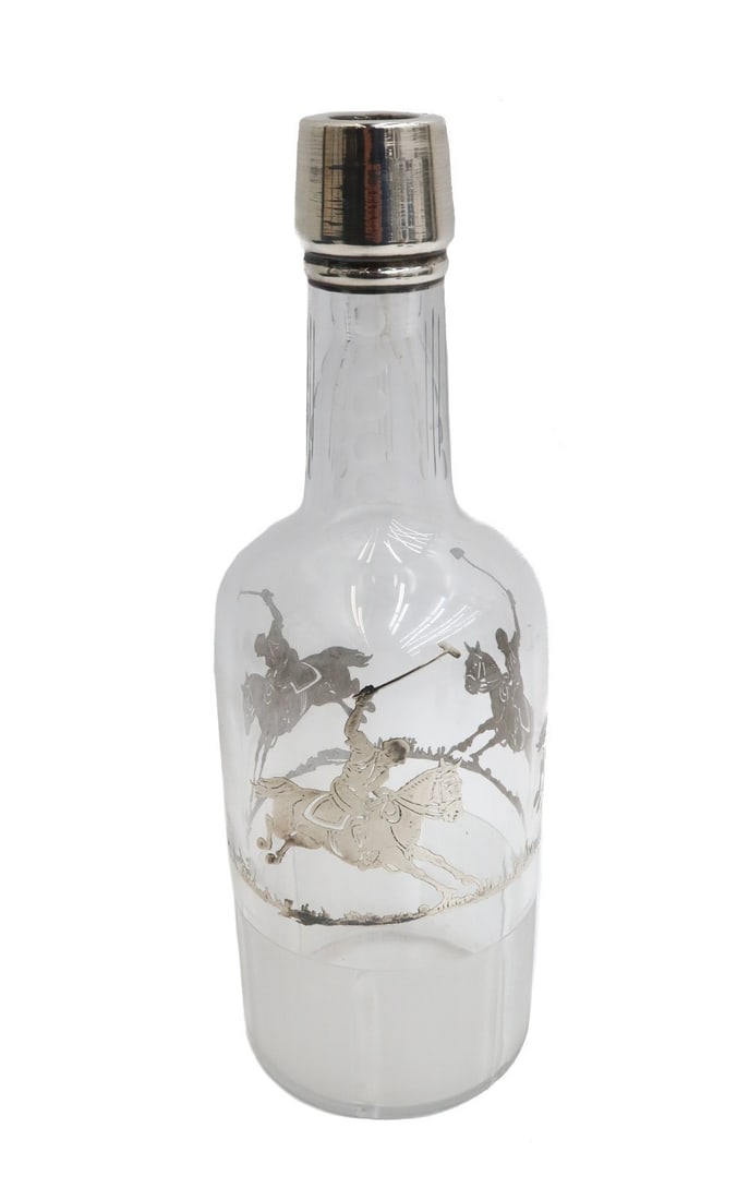 American Silver Overlay Jockey and Horses Glass Decanter: American silver overlay glass decanter. Etched jockeys and horses to circular band. Frosted to bottom half of decanter. Weight: Approx. 1 lb Measurements: Approx. 3.5 inches diameter x 10.5 inches tal