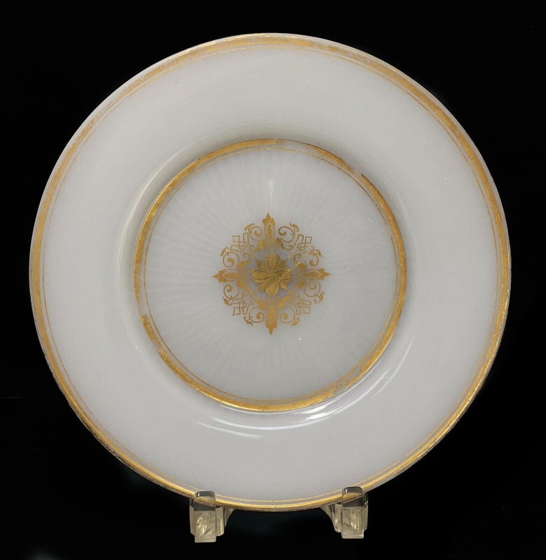 French White Opaline and Gilt Cabinet Plate, circa 1920: French white Opaline and gilt cabinet plate, circa 1920 . Gilt scroll medallion to the center. Starburst design to the underside base. Weight: Approx. 1 lbs Measurements: Approx. 10.75 inches diameter
