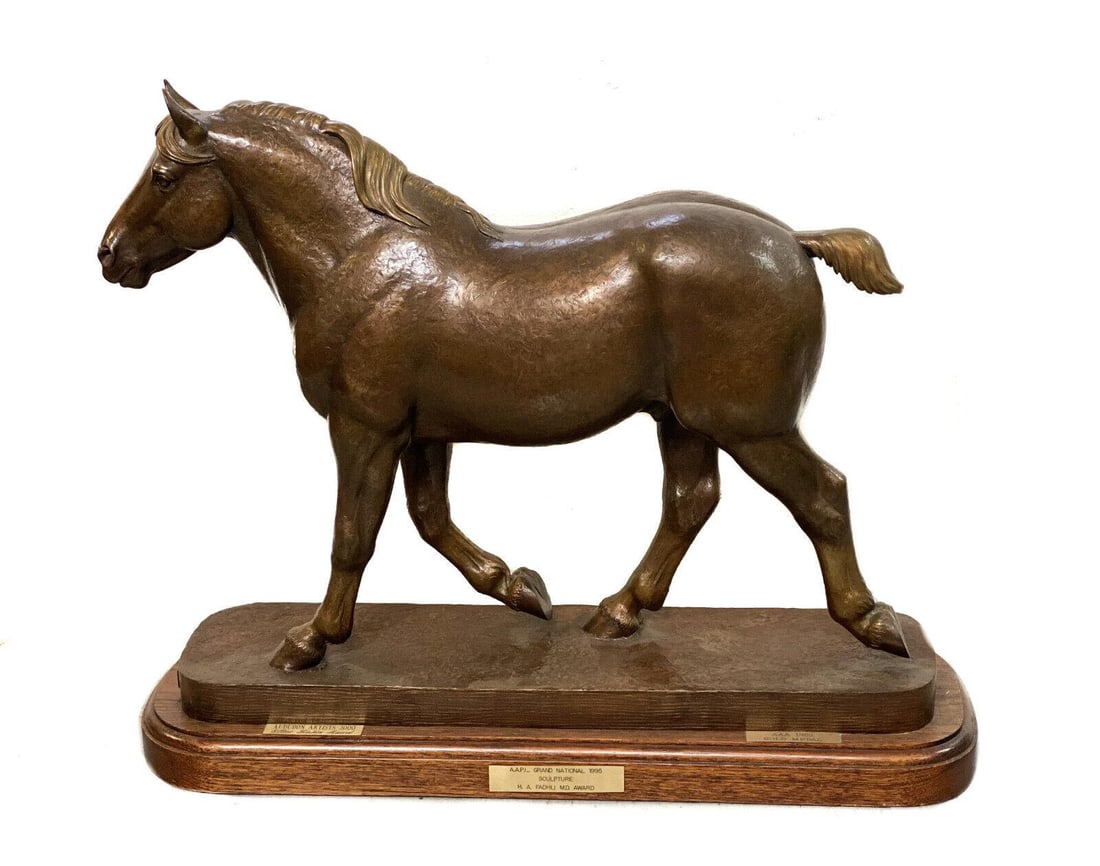 Marilyn Newmark Bronze Horse Sculpture, Herculean Limited Edition of 5, 1994: Large Marilyn Newmark Exhibition Bronze Sculpture, titled Herculean, Limited to an Edition of 5, dated 1994. The sculpture depicts a realistically modeled trotting Stallion, with textured skin and eve