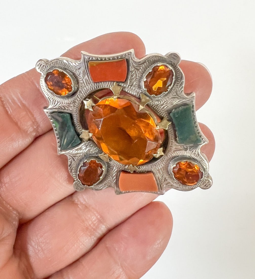 Scottish silver Agate and Faceted glass Brooch Early 20th Century: Victorian Scottish Silver brooch with faceted citrine-colored glass and bloodstone, agate. Finely engraved. Brooch tested silver; pin and closure not testing as silver Measurements: Approx. 15.39grams
