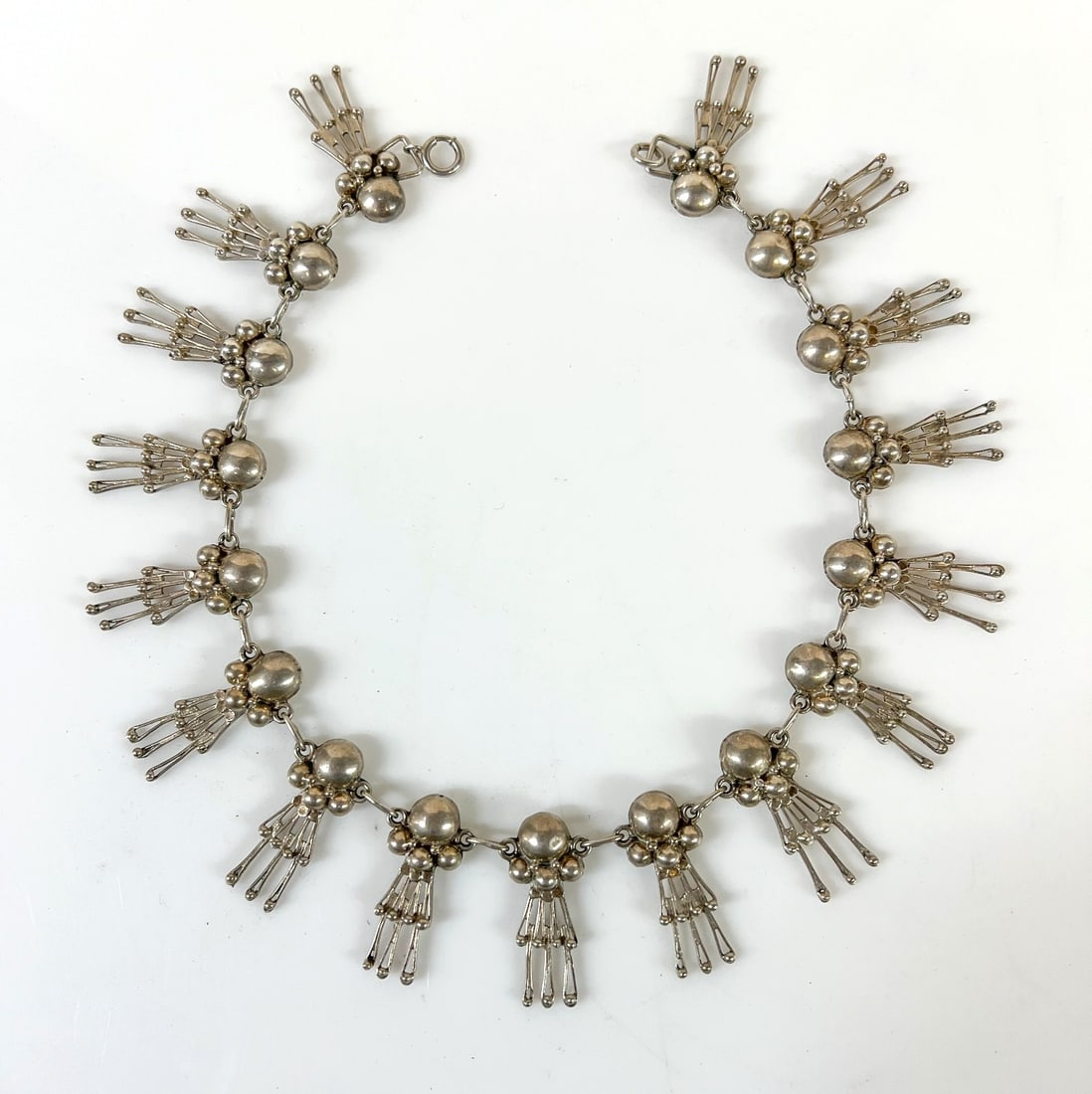 Vintage Sterling Silver Mexican Doll Necklace Choker: Vintage Sterling Silver Mexican Los Ballesteros Doll Necklace Choker, 17 doll forms. Marked 'Sterling' on the spring ring, otherwise, unmarked. Tested silver. Measurements: Approx. 53.47grams (1.7191o
