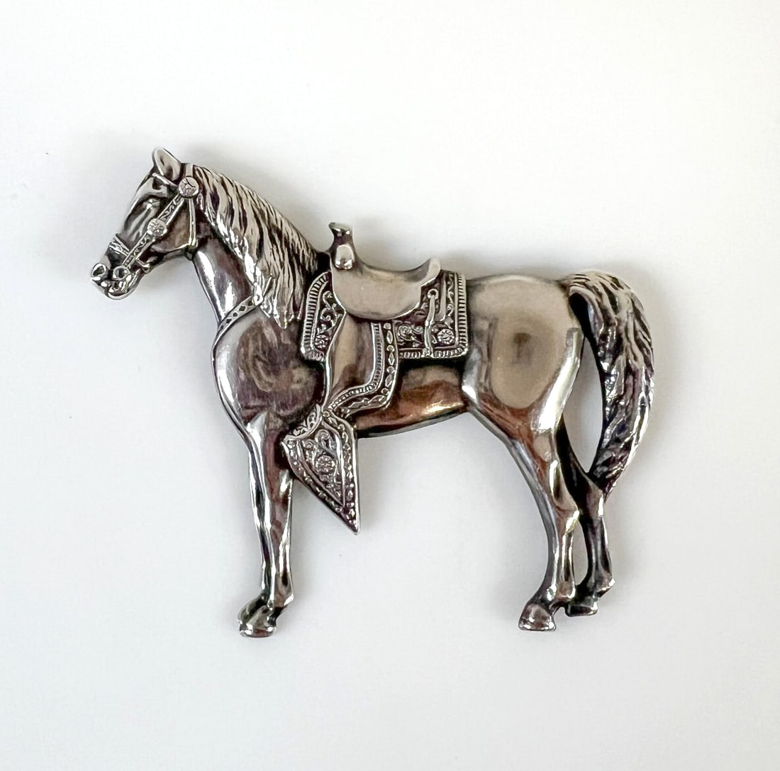 Vintage Sterling Silver Western Horse Brooch c1940-50: Vintage Sterling Silver Western Horse Brooch,c1940-50, beautifully detailed. Marked 'Sterling' on reverse. Measurements: Approx. 15.28grams; 2.5 x 2.25 inches Condition: Great condition, light signs o