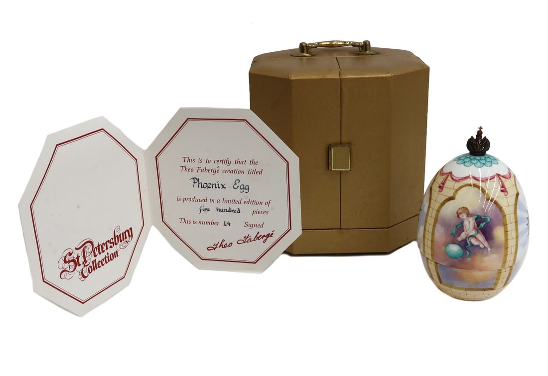 Theo Faberge Phoenix Egg Porcelain Sterling Silver Vermeil with Box Ltd Ed 500: Theo Faberge "The Phoenix Egg" from the St Petersburg Collection. Hand painted porcelain egg decorated with putti, opens to reveal a sterling silver phoenix emerging from vermeil flames, Birmingham En