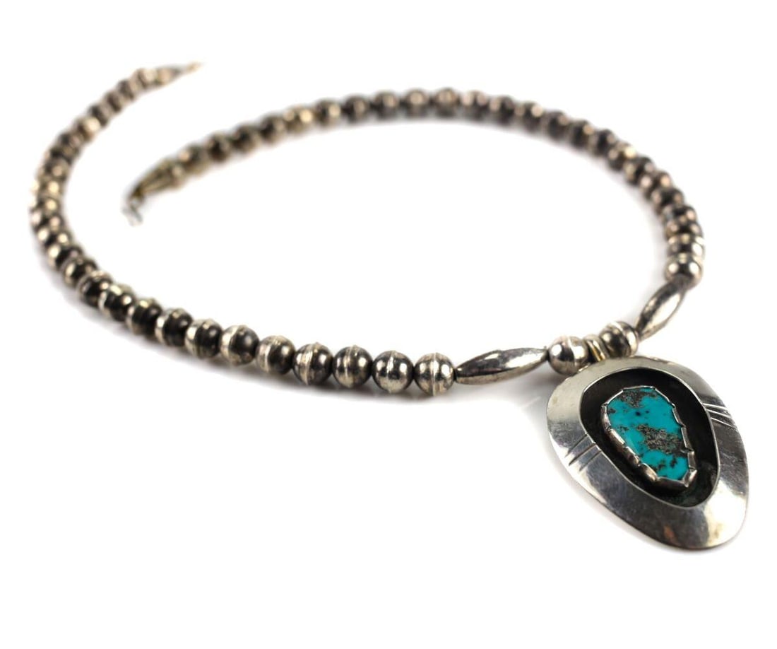 19in Navajo Sterling Silver Turquoise Necklace pear form shadowbox pendant: 19inches Navajo Sterling Silver Turquoise Necklace, pear form shadowbox pendant. Hook and eye latch. Unmarked. 34grams Measurements: Approx. 19inches length Condition: Very good condition, some signs 