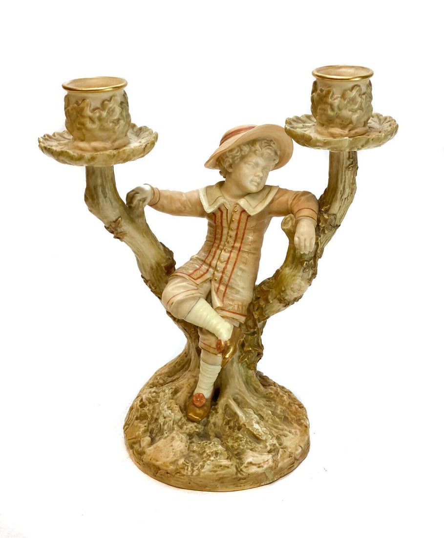 Royal Worcester Hand Painted Porcelain Figurine, Boy on a Tree Branch Candelabra: Royal Worcester hand painted porcelain figurine, Boy on a Tree Branch two light candelabra. The candelabra depicts a boy relaxing at the base of a tree. Artist signed Hadley. Royal Worcester mark to t