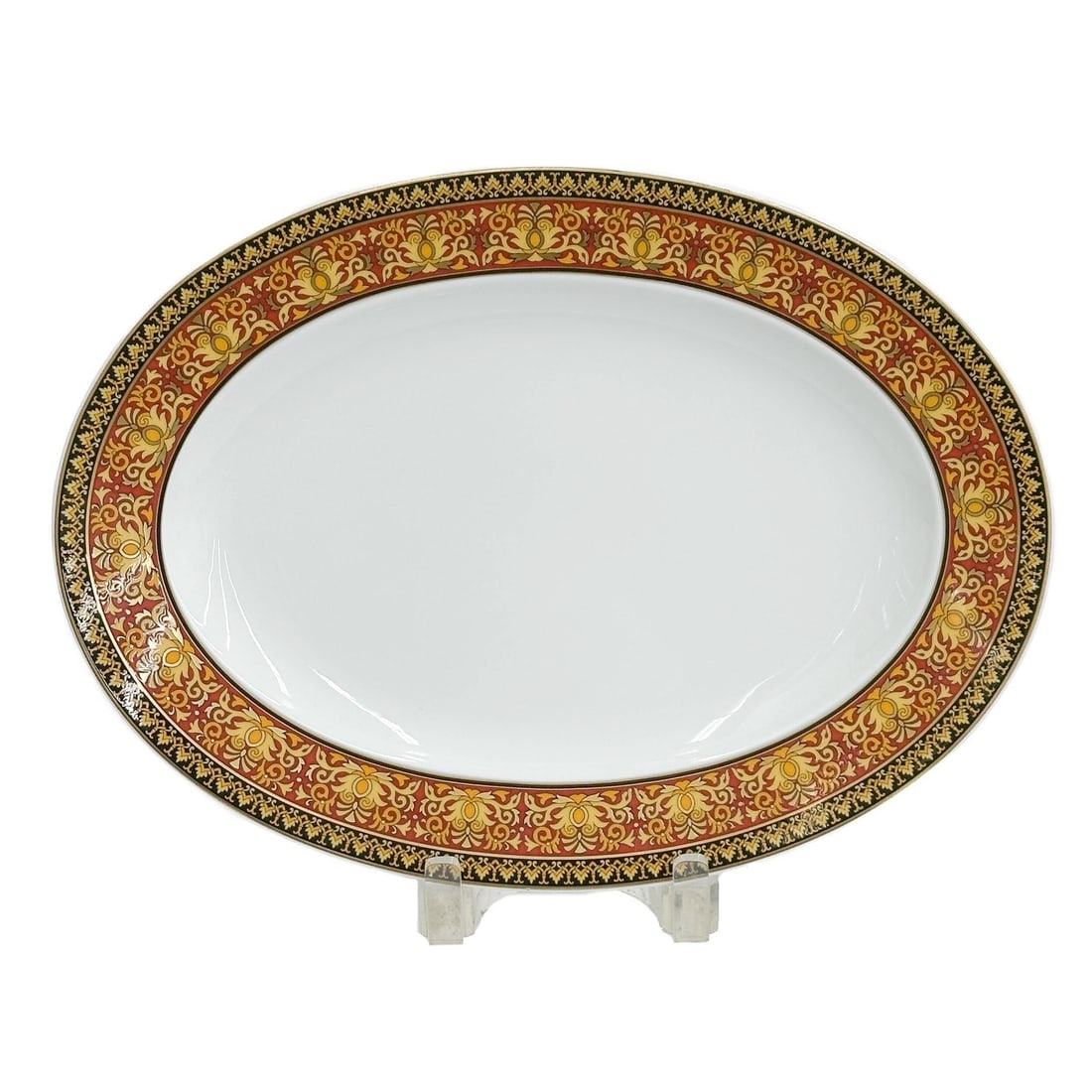 Versace Rosenthal Porcelain 13in Oval Serving Tray in Medusa: Versace Rosenthal Porcelain Oval Serving Tray in Medusa. A rust red and black ground with ornate baroque gilt foliate scrolls around the rim. Versace Rosenthal mark to the underside base. Weight: Appr