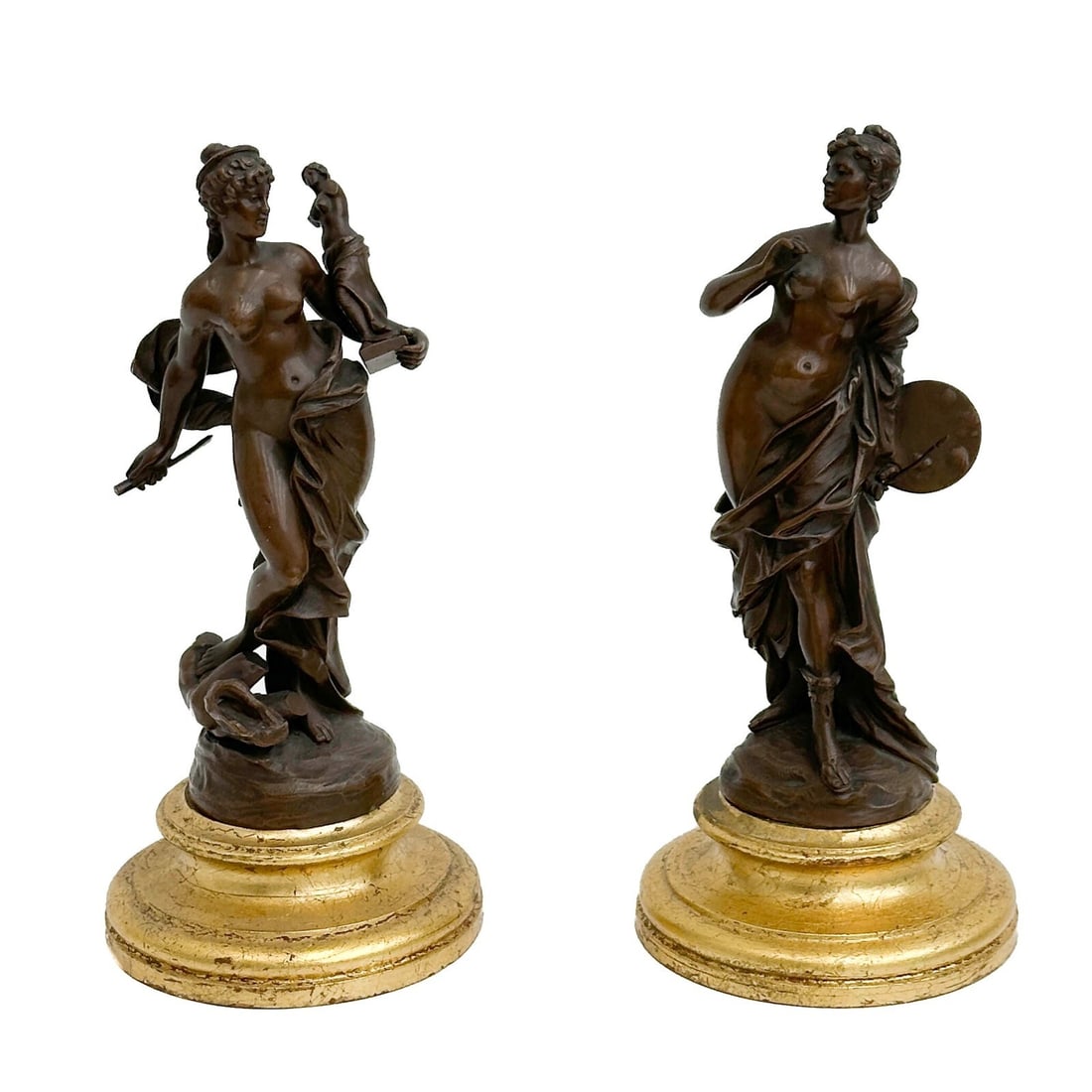 Pair Continental Bronze Figurines Women the Arts 19th century: Pair Continental Bronze Figurines, 19th century. Depicts a pair of nude women holding the arts, sculpture and painting. Gilt circular wood bases. Weight: Approx. 7 lbs Measurements: Approx. 4.125 inch