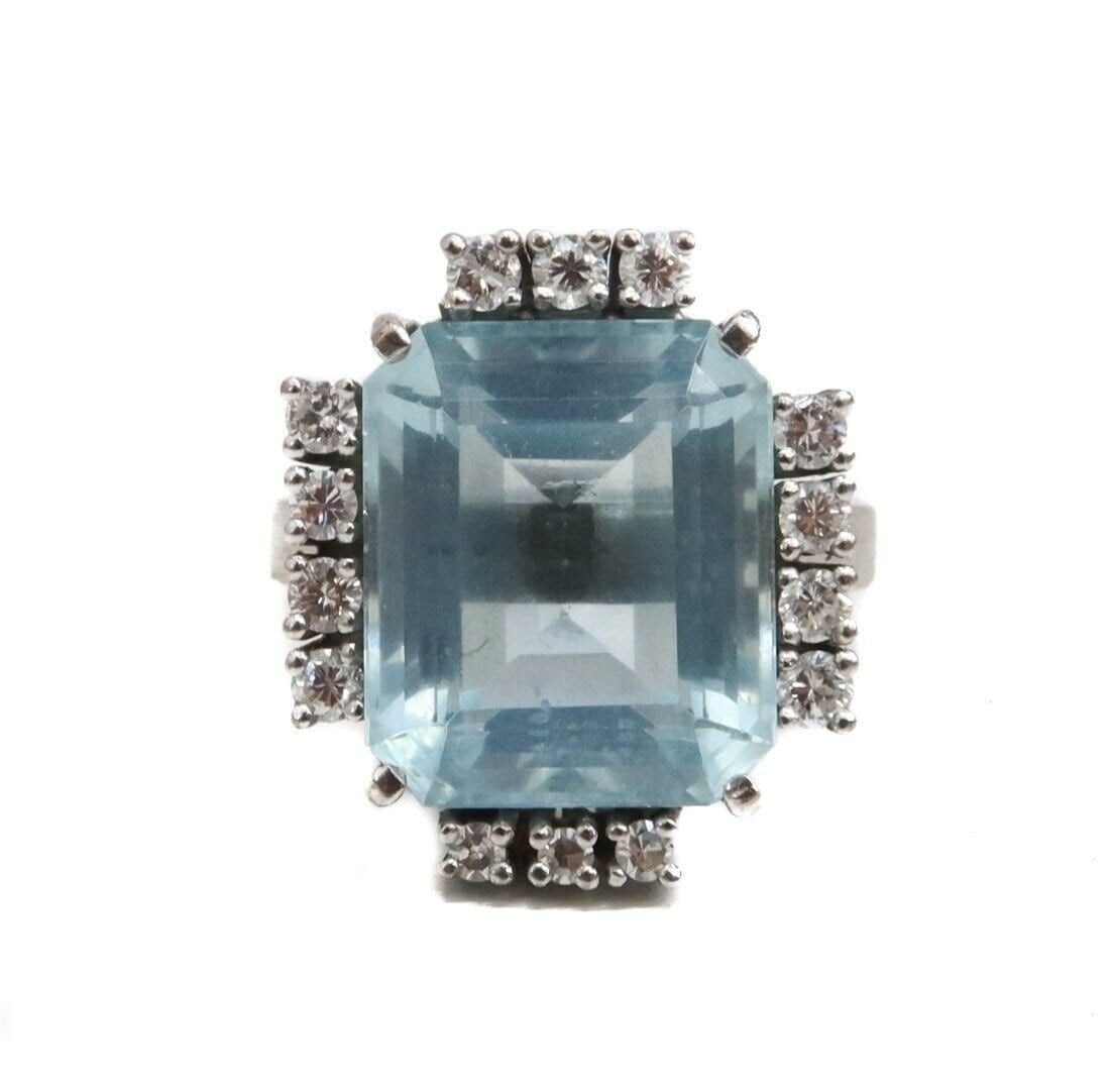 14k White Gold Aquamarine and Diamond Ring, Size 5.5: 14k White Gold Aquamarine and Diamond Ring, Size 5.5. Rectangular step cut aquamarine center weighing approximately 7 carats. 14 brilliant round cut diamonds to the frame weighing approximately 0.55 c