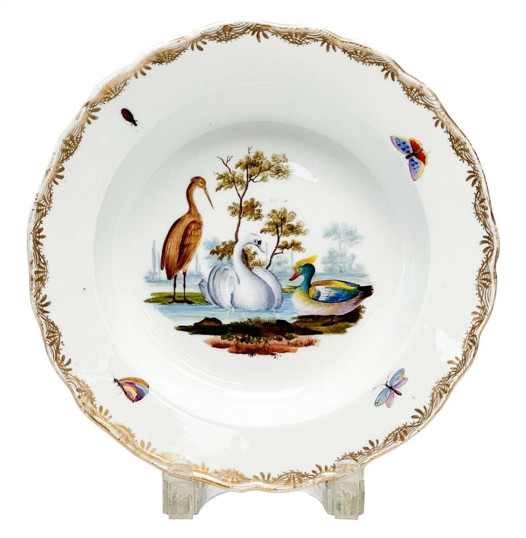 Meissen Germany Hand Painted Ornithological & Insect Porcelain Rimmed Soup Bowl: 19th century Meissen Germany hand painted porcelain rimmed soup bowl. Hand painted scene featuring a swan, duck, and heron in a lake to the center, insects and gilt design to the scalloped rim. Unders