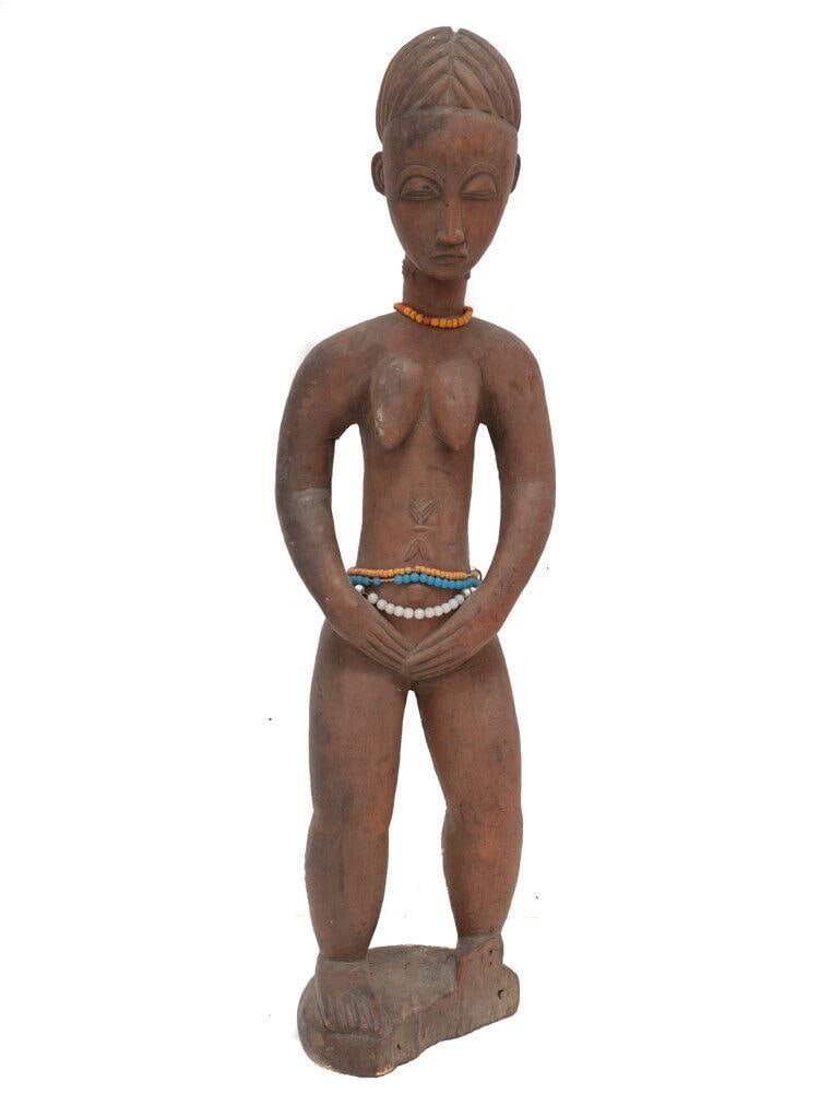 African Carved Wood BAULE Hemba Female standing figure Tall elegant: African Carved Wood BAULE Hemba? Female standing figure, Tall, elegant carving, with scarafication, glass bead ornaments.4.25lbs Measurements: Approx. 23.25" height x 6.5" x 4". Condition: Condition c