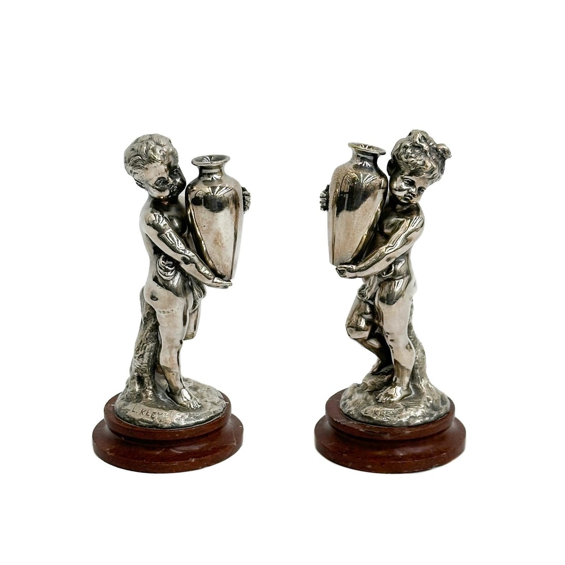 Pair Louis Kley French Silvered Bronze Figurines on Marble Bases Signed c1900: Pair Louis Kley (French, 1833-1911) Silvered Bronze Figurines on Marble Bases circa 1900. Depicts a pair of putti each holding a vase, mounted on red marble bases. Each signed L Kley to the lower edge