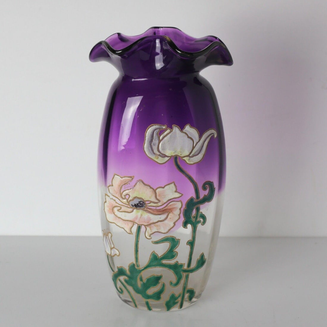 Mont Joye Art Glass Vase in amethyst floral hand painted raised enamel ruffled: Mont Joye Art Glass Vase in amethyst, floral hand painted raised enamel, ruffled mouth. Fluted sides. Purple to clear. Unmarked. 2lbs Measurements: Approx. 10inches height Condition: Great condition, 