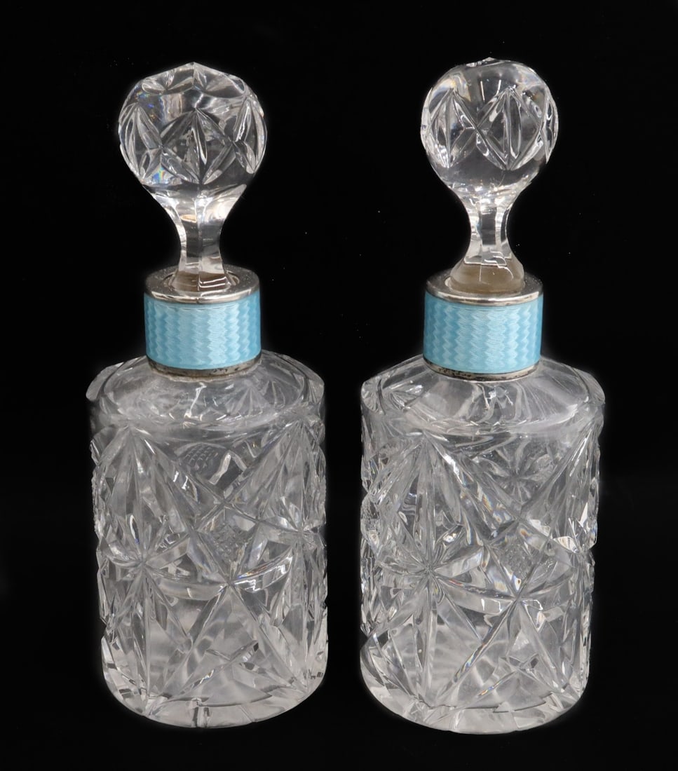 Pair German 935 Sterling Silver and Guilloche Enamel Cut Glass Perfume Bottles: Pair German 935 sterling silver and guilloche enamel cut glass perfume bottles. Diamond cut glass design throughout. Blue guilloche to neck. Marked "Germany Sterling 935" Weight: Approx. 1 lbs Measure