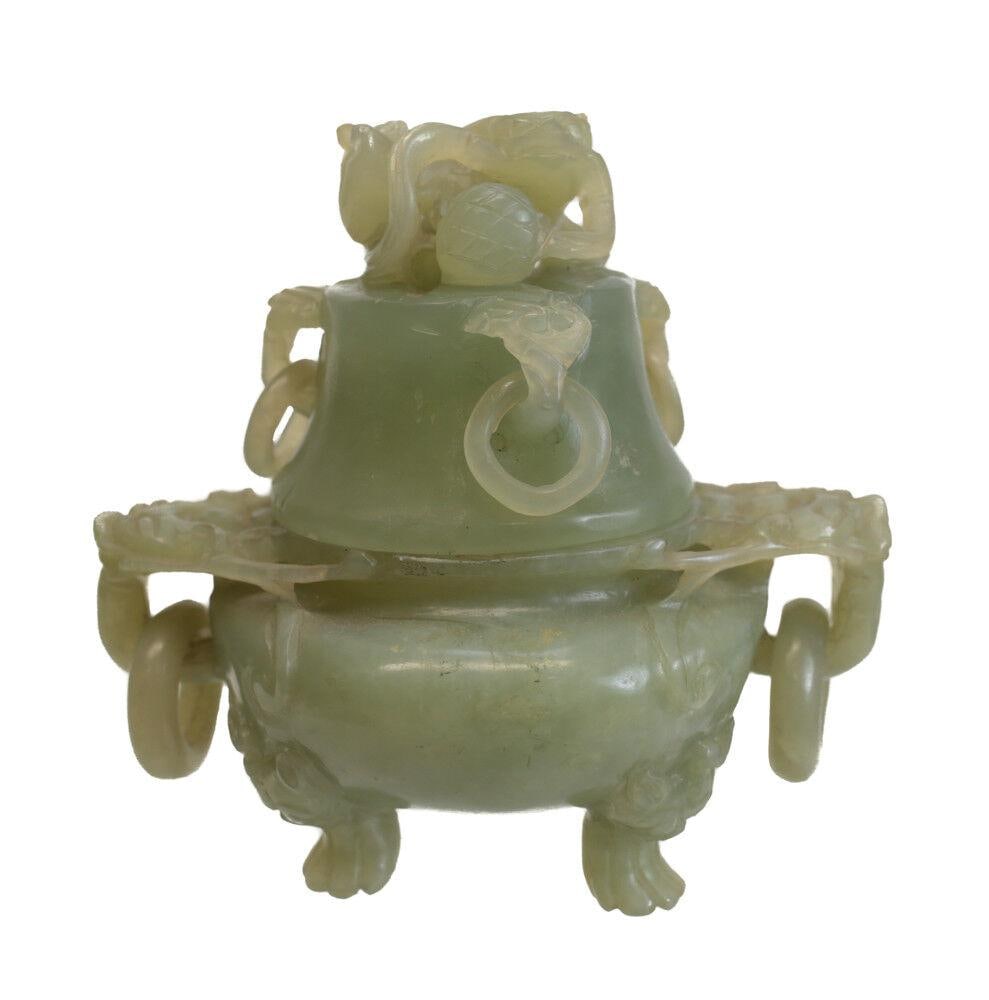 Jade Carved Dual Dragon Head handled censer, foo dog finial. Loose rings: Jade Carved Dual Dragon Head handled censer, foo dog finial. Loose rings at the handles, and lid. 1.25lb Measurements: Approx. 4.5" height x 4.75" handle to handle. Condition: Good condition, Small sc