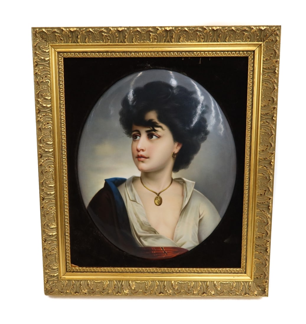 KPM Berlin Porcelain Oval Plaque of a Neapolitan Child Gilt Wood Frame 19th C.: KPM Berlin porcelain oval plaque of a Neapolitanic child, 19th Century. The plaque depicts a child with white, brown and red garbs and wearing a gold necklace. Impressed KPM mark to verso. Red velvet 