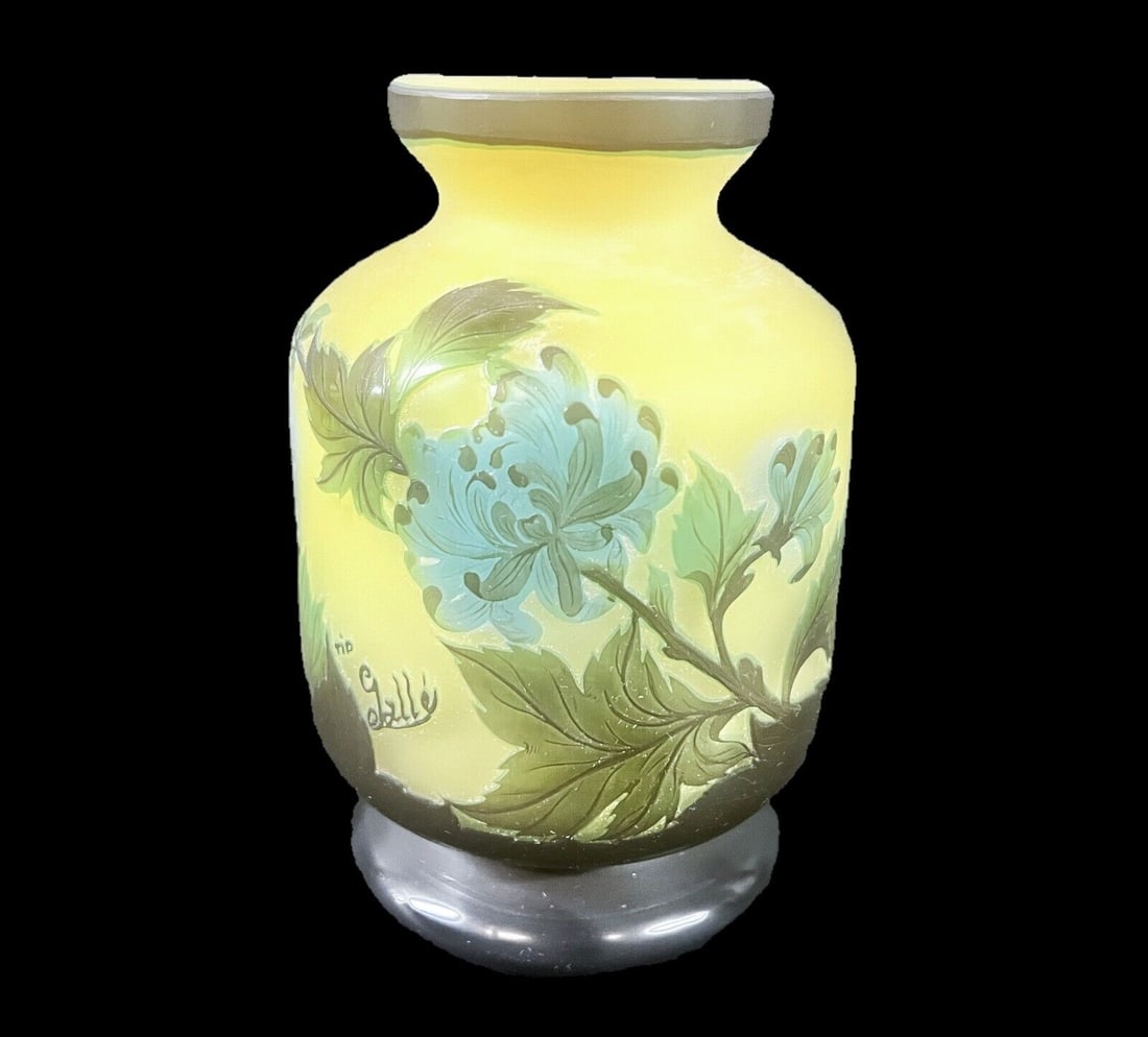 Tip Galle art glass Vase, Floral Design Yellow Blue Green: A vintage Tip Galle Vase, cylindrical form with a narrow mouth and foot. Floral design in deep olive green and blues on amber yellow. Marked Tip Galle. 2lb Measurements: Approx. 6.75 in height x 4.25 