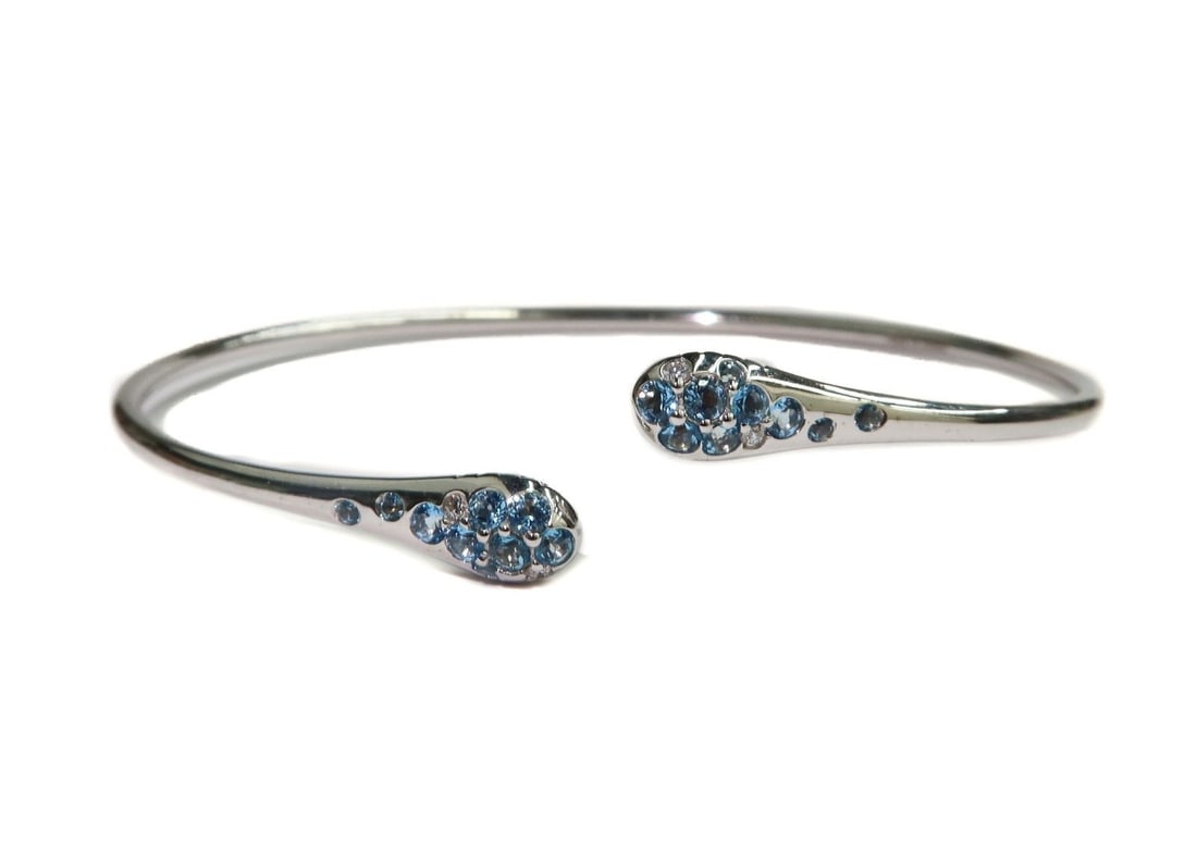 Italian 750 White Gold Ombre Via Fiori Scuri Blue Topaz Diamond Cuff Bracelet: Italian 750 18k White Gold Ombre Via Fiori Scuri Blue Topaz and Diamond Cuff Bracelet. Round cut blue topaz and diamonds to cuff with the diamonds weighing approximately 0.05 carats. Monogrammed "PVG"