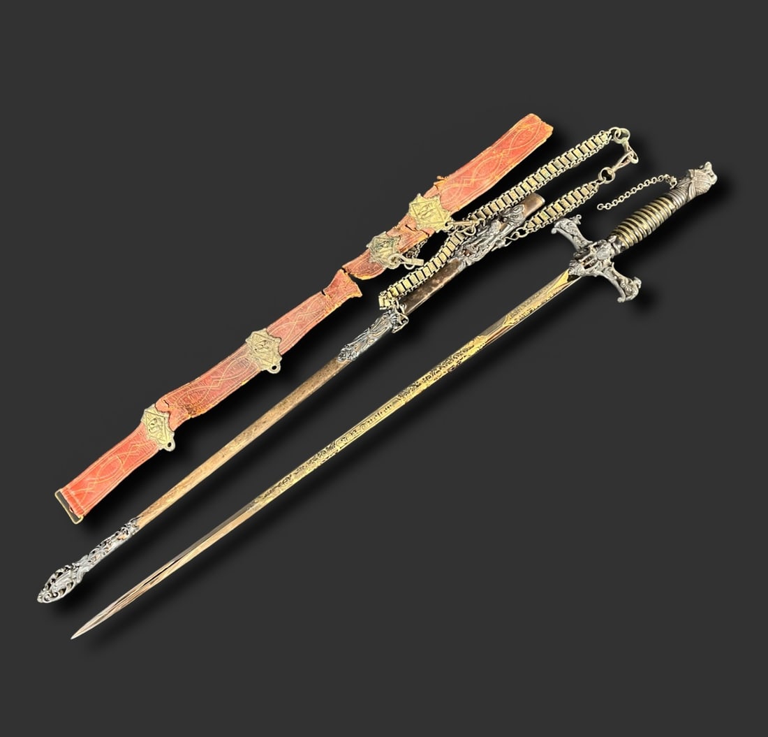 Knights of Pythias Ceremonial Sword and Scabbard early 20th century: Knights of Pythias Ceremonial Sword and Scabbard, and partial strap; by Pettibone Mfg., Cincinnati, OH. On the scabbard, a raised figure of the biblical Samson and the initials "FCB." On the sword, a 