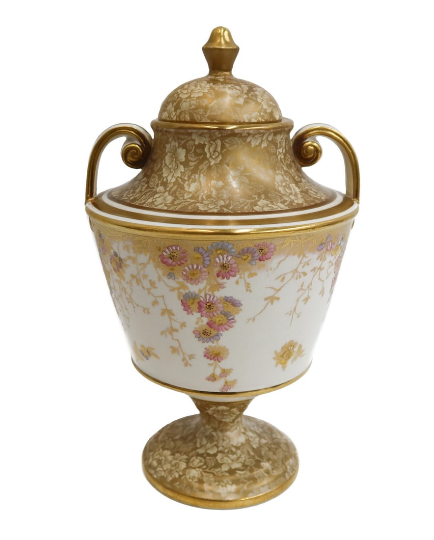 Wedgwood England Porcelain Hand Painted and Gilt Twin Handled Urn circa 1880: Wedgwood England porcelain hand painted and gilt twin handled urn, circa 1880. A white ground with gilt accents and hand painted flowers throughout. Wedgwood England mark to underside. Weight:
