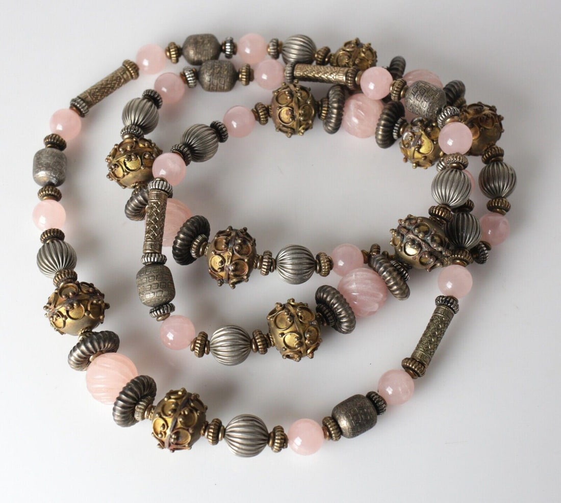 Vtg Large Silver Brass Beaded Rose Quartz Tribal Chunky NECKLACE 52 in: Statement Necklace - Brass, nickel silver and rose Quartz continuous Tribal NECKLACE, multi-shaped beads, round and carved quartz beads. Unmarked. Measurements: Approx. 313.43grams. 26inches drop,