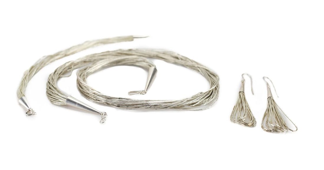 3pc Multistrand Liquid Silver 19in Necklace 30 strands bracelet earrings: Multi-strand Liquid Silver Necklace, bracelet and earring set. Necklace 30 strands, bracelet 20 strands, pierced dangle earrings 10 strand. Makers mark on bracelet and earrings, necklace marked sterli