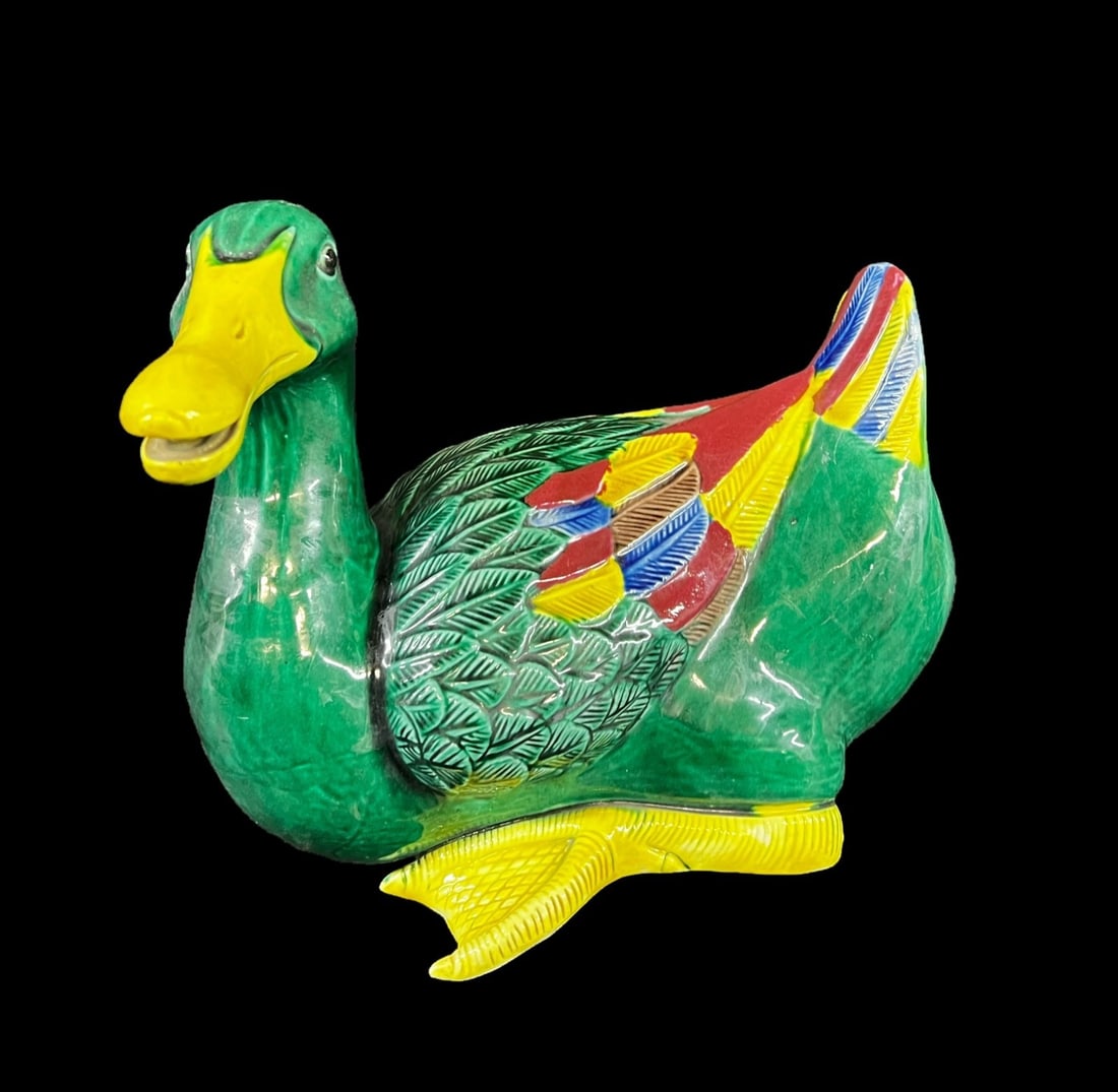 Chinese porcelain polychrome duck Figurine: Chinese porcelain polychrome duck, 20th century, the duck in green glaze with highlights in yellow, red and blue. Measurements: Approx. 9 x 7.75 x 5.25 inches Condition: Great condition, no chips or c