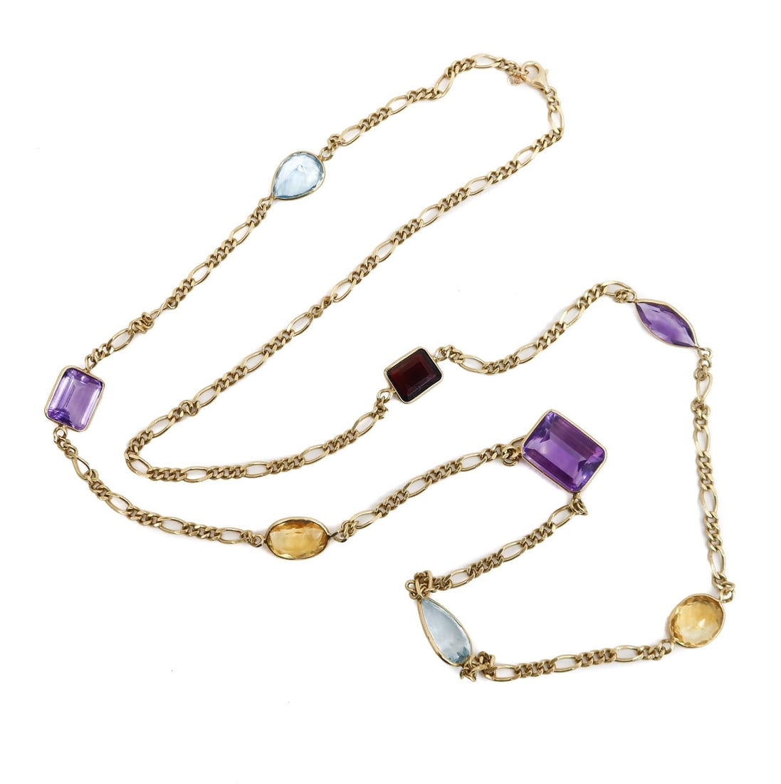14k Yellow Gold Italian Topaz Amethyst and Garnet Figaro Chain Necklace: 14k Yellow Gold Italian topaz amethyst and garnet figaro chain necklace. Pear shaped topaz with rectangular and marquise amethysts, oval citrines, and a square garnet. Marked 14k gold mark to chain. W