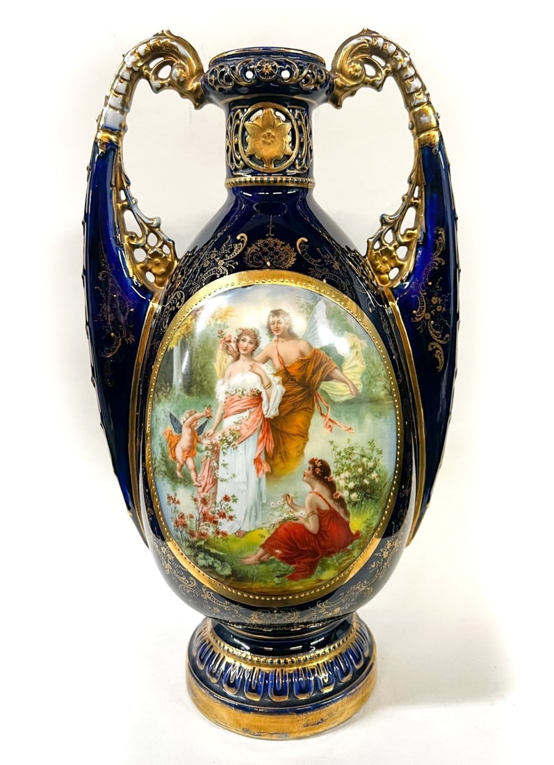 Royal Vienna Cobalt Blue Footed Vase: Royal Vienna Cobalt Blue Footed Vase, early 20th century, raised gilt beading, mythological scene. Dual scroll handles. Underglaze mark to the foot. Measurements: Approx. 14 inches height Condition: G