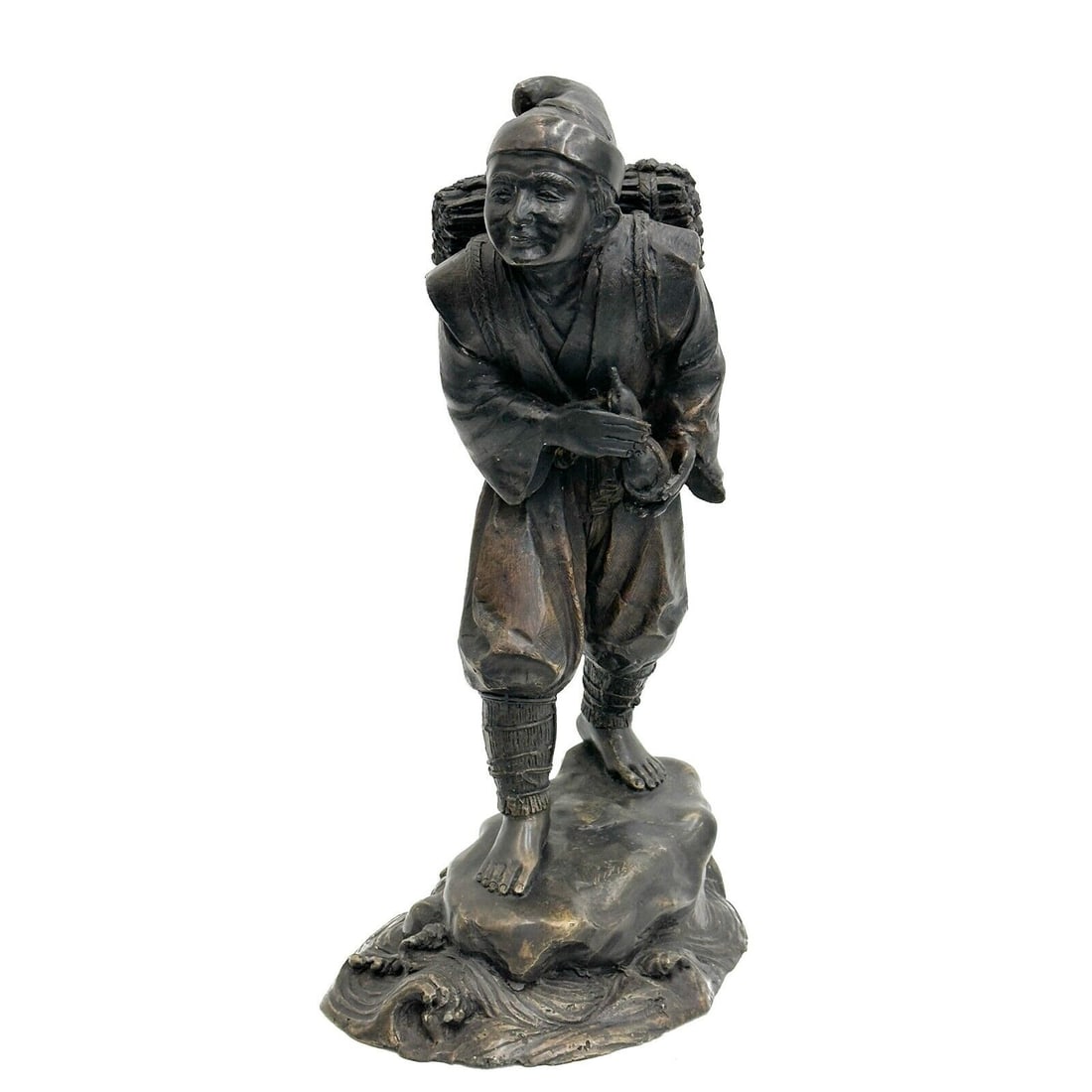 Japanese Bronze Okimono Sculpture of a Man: Japanese Bronze Okimono Sculpture of a Man Weight: Approx. 15.5 lbs Measurements: Approx. 9 inches x 6 inches x 17 inches tall Condition: Good condition, wear to patina. Domestic Shipping:$90