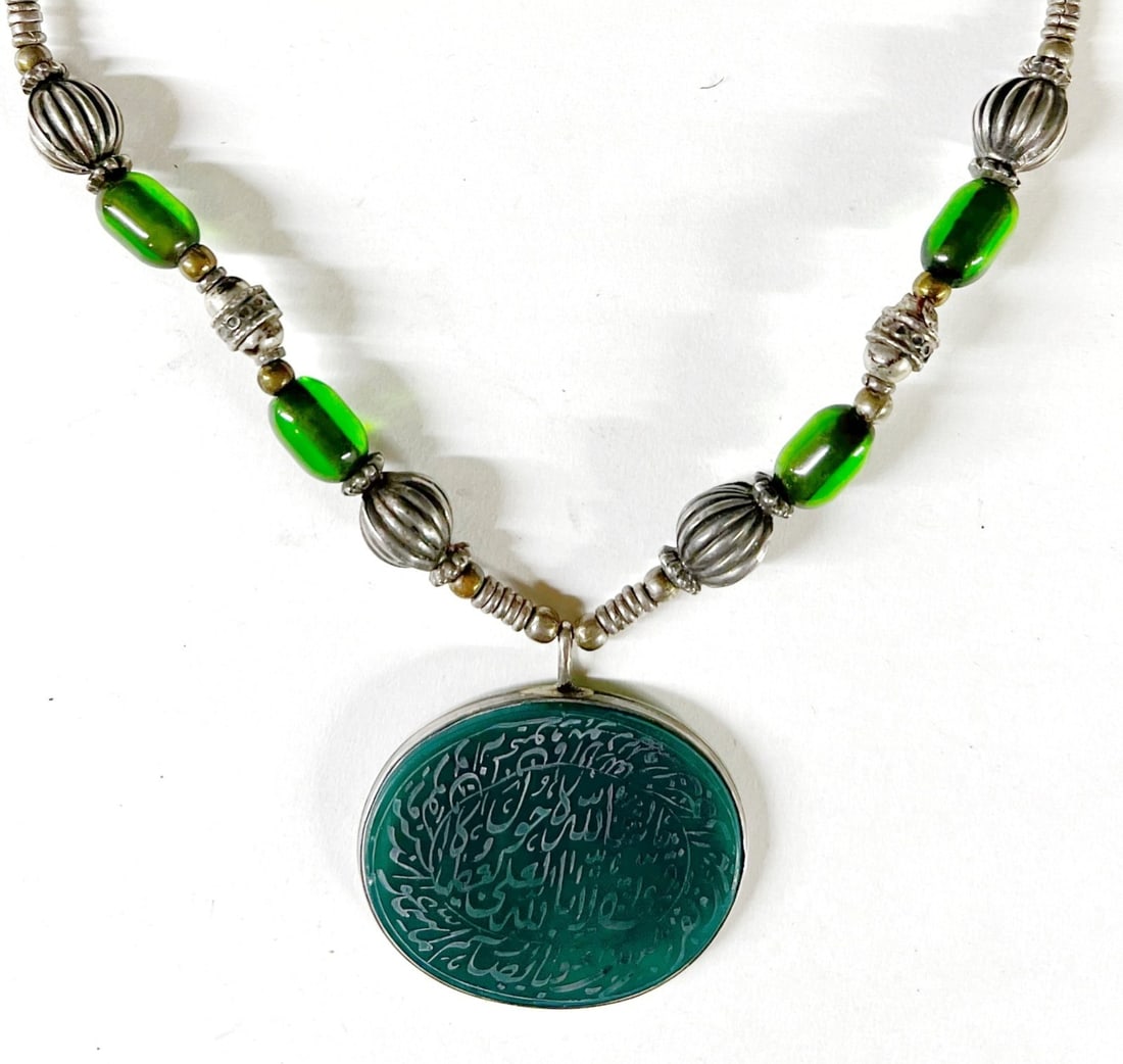 Hirz Bedouin Green Aqeeq Agate Silver Necklace engraved calligraphy pendant: Hirz / Bedouin Green Agate / Aqeeq Silver Necklace; likely Yemini green agate with very fine engraved Arabic / Islamic calligraphy; necklace has green glass beads and silver beads, and a few brass bea