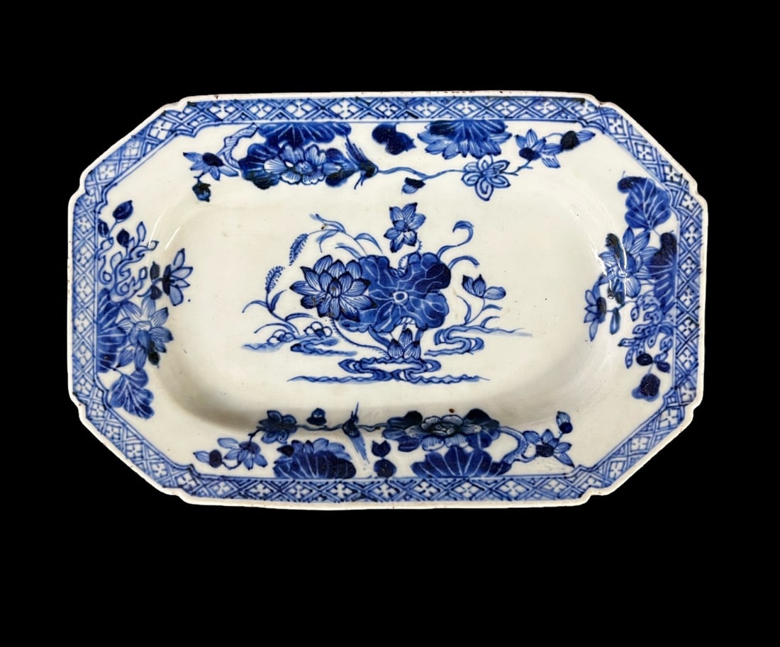 Chinese Blue and White porcelain platter: Chinese Blue and White porcelain platter, likely Qianlong, Lotus flower design. Unmarked, saved for small 'v' impression. Measurements: Approx. 9.5 x 6.125 inches Condition: Good condition, scattered 