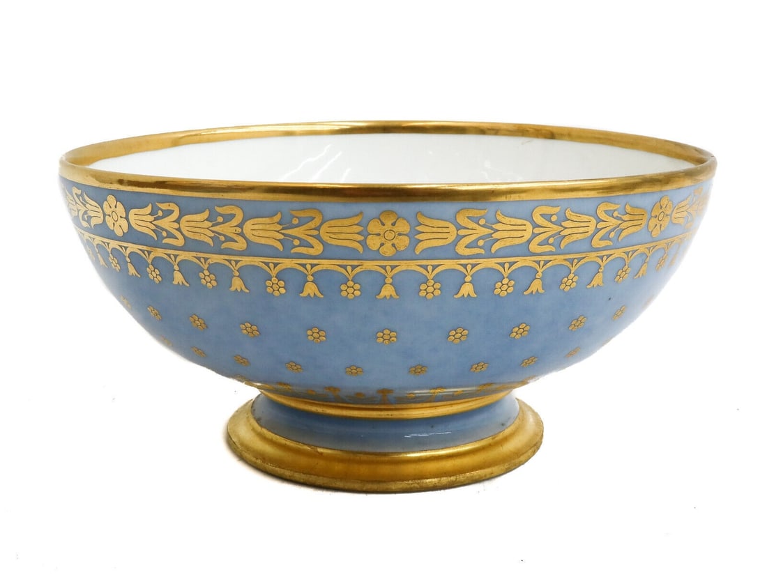 Manufacture de Sevres Porcelain Footed Bowl Periwinkle Blue Gilt Flowers 1819: Manufacture de Sevres porcelain footed bowl, 1819. Periwinkle blue ground with gilt flowers and to circular band and throughout exterior. Manufacture de Sevres mark to underside with incised letters a