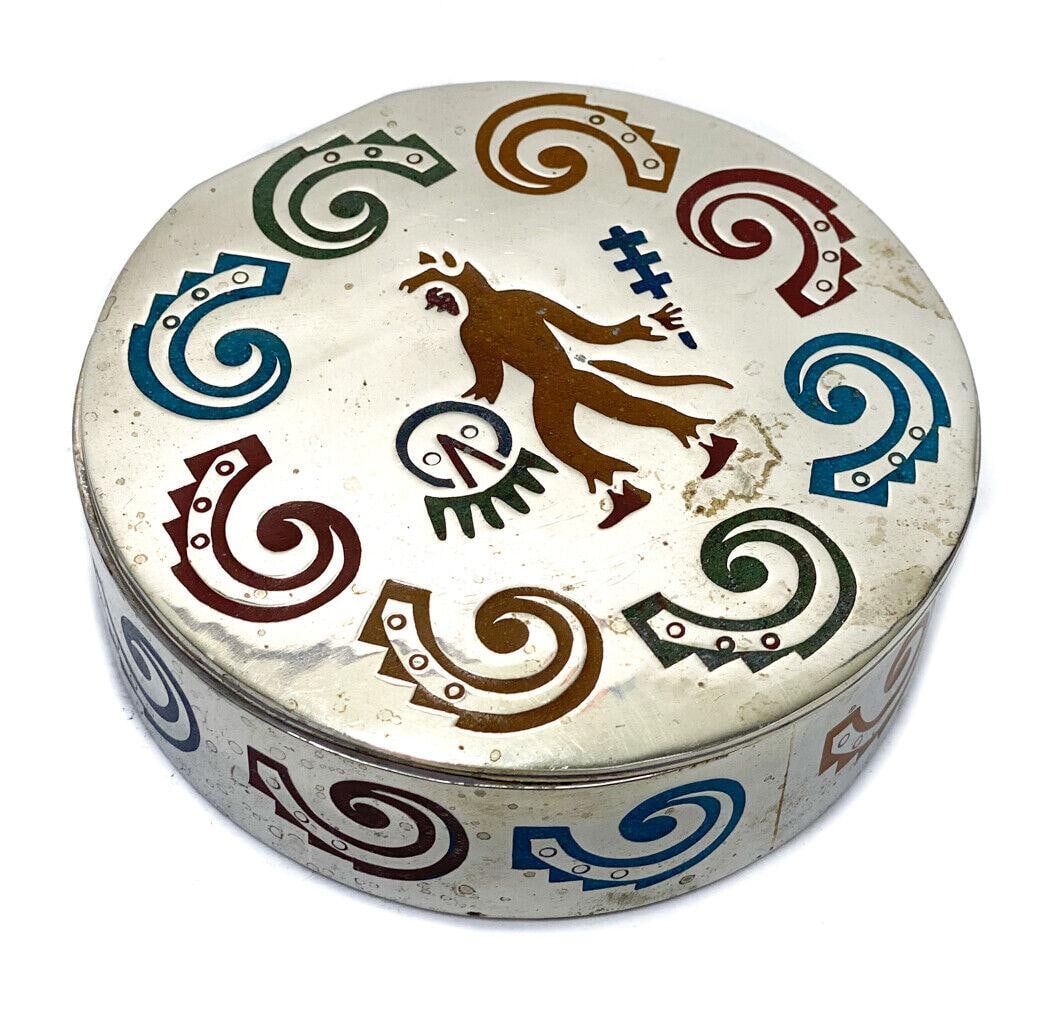 Mexico Alpaca Metal and Stone Inlaid Round Jewelry Box.: Mexico Alpaca metal and stone inlaid round jewelry box. Multi-stone inlay around the lid and to the wall with a figural man to the center. Red fabric lining to the interior. Mexico Alpaca mark to the 