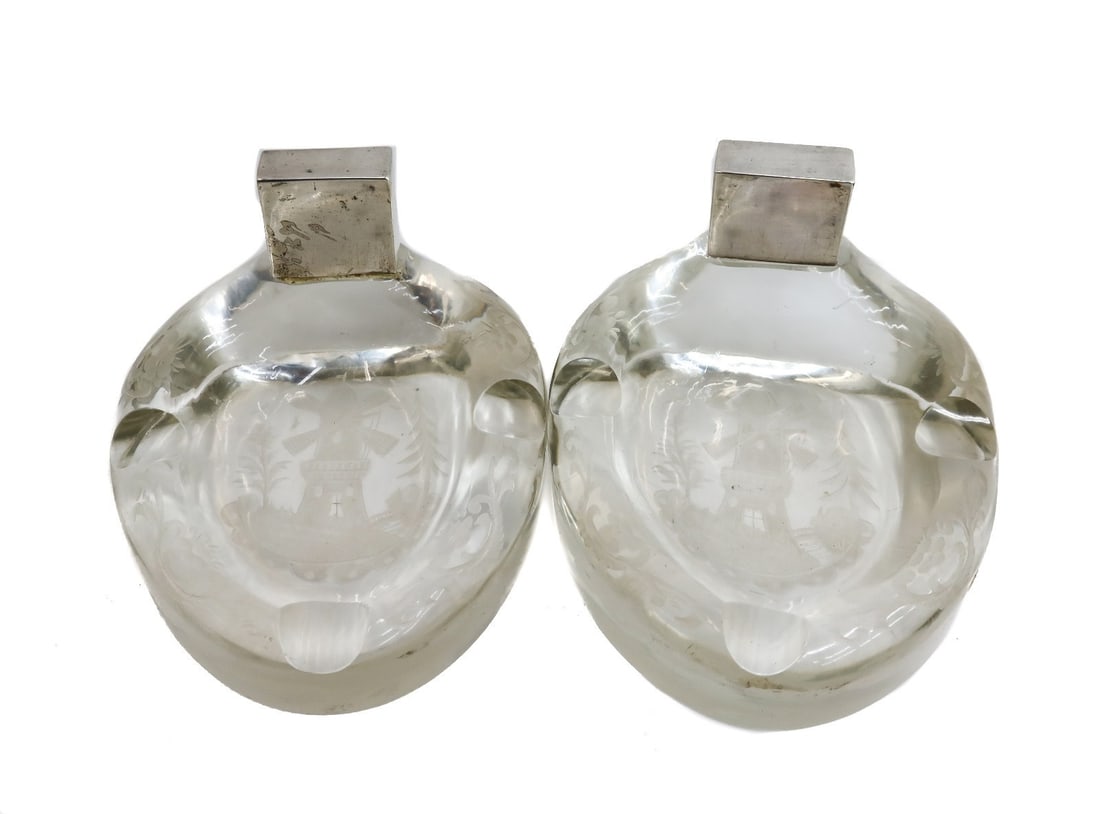 Pair German Silver and Glass Horseshoe Ashtrays, circa 1900: Pair German silver and glass horseshoe ashtrays, circa 1900. The glass with engraved windmills. The top tests for silver. Weight: Approx. 4 lbs Measurements: Approx. 5.25 inches x 4.5 inches x 4 inche