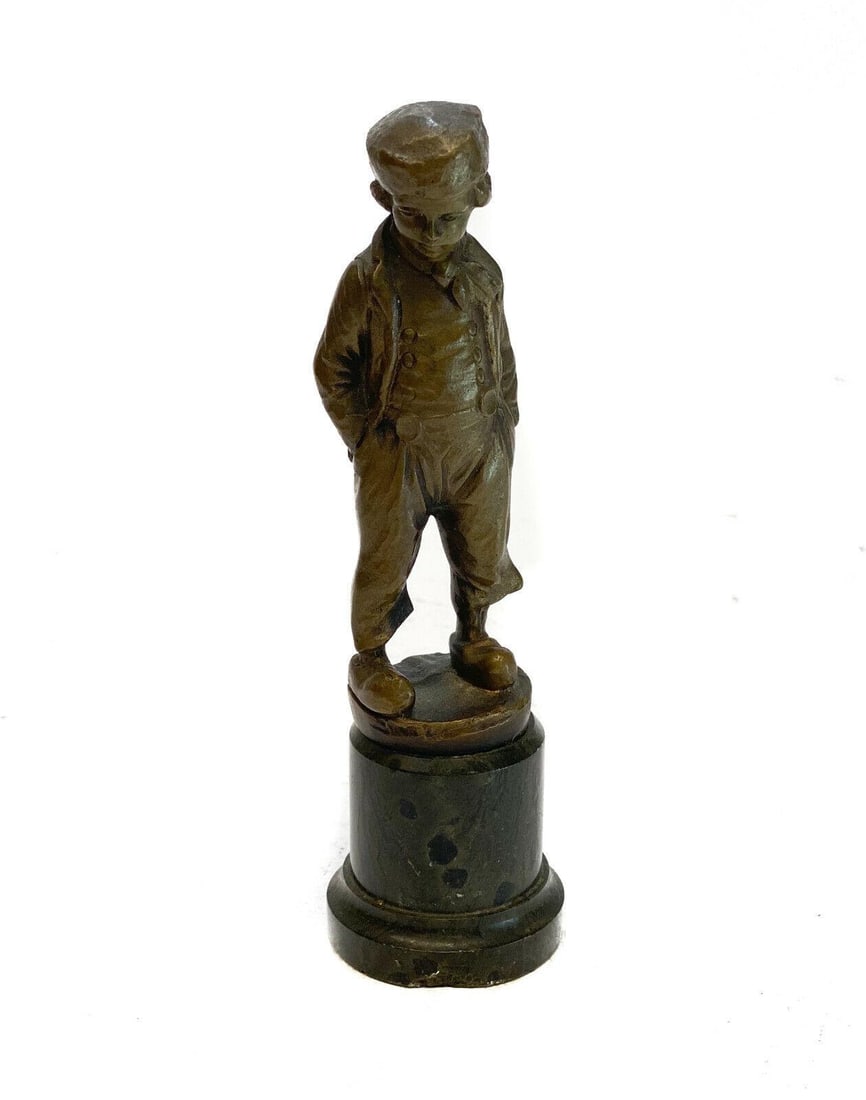 Continental Patinated Bronze Sculpture of a Boy in a Newsboy Cap, circa 1920: Continental patinated gilt bronze sculpture of a boy in a newsboy cap, circa 1920. Mounted to a dark stone base. Unsigned. Weight: Approx. 2 lbs Measurements: Approx. 5.75 inches tall Condition: Great