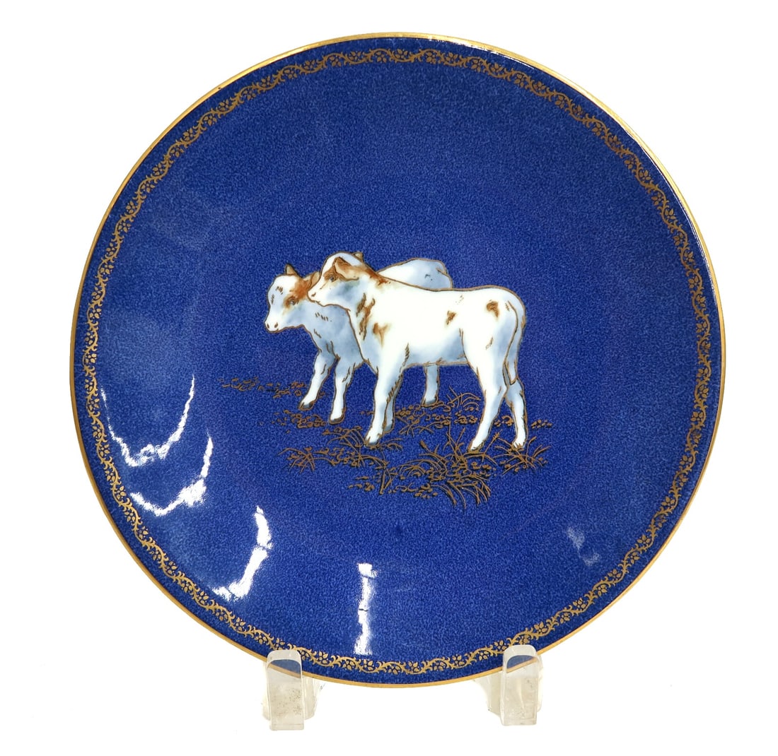 Wedgwood England Porcelain Powdered Cobalt Blue Gilt Plate Calves circa 1900: Wedgwood England Porcelain powdered cobalt blue and gilt 8.9 inch plate, circa 1900. Powdered cobalt blue ground with a pair of hand painted white and gilt calves to center. Wedgwood England mark to u