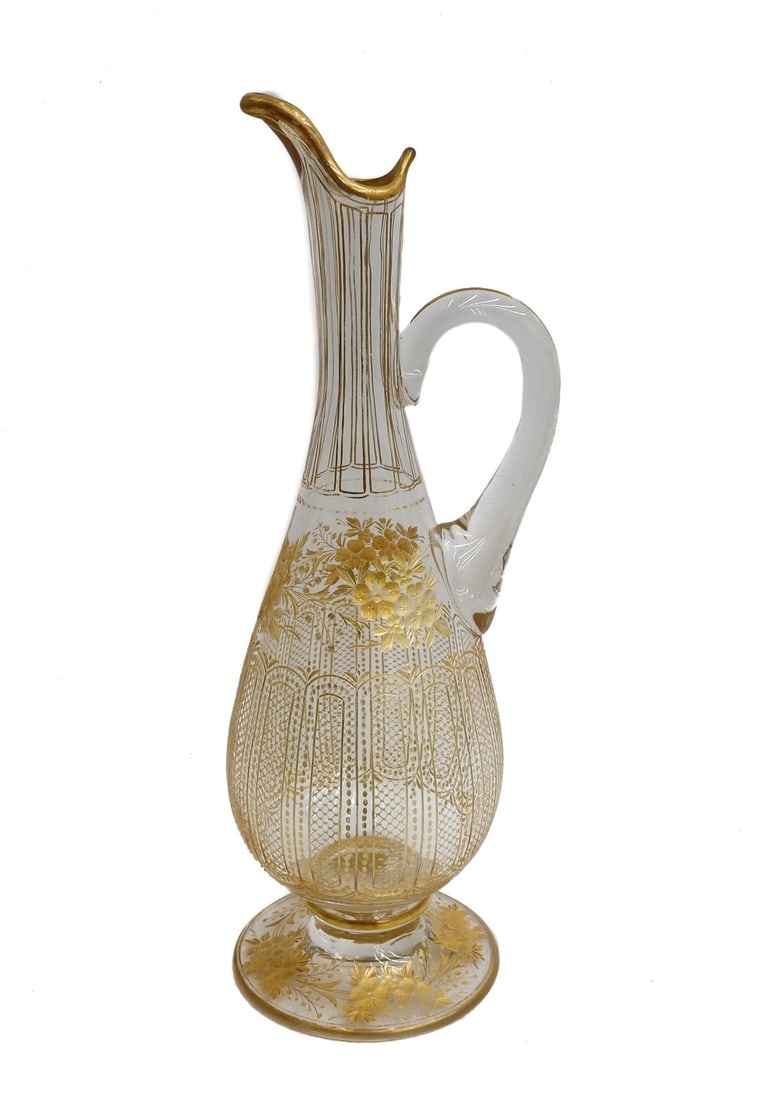 Bohemian Intaglio Cut and Gilt Glass Ewer circa 1920 Gilt Florals: Bohemian intaglio cut and gilt glass ewer,circa 1920. Gilt florals and crosshatch design panels throughout. Weight: Approx. 1 lb Measurements: Approx. 4 inches diameter x 11 inches tall Condition: Ver