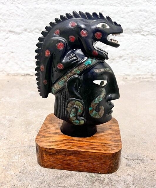 Mexican Black Stone Onyx Sculpture with inlays Mayan Bust Iguana Malachite: Mexican Black Stone Onyx Sculpture with inlays - Bust with Iguana. Malachite and stone inlay. Wood base, removable. C mid 20th century. Approx 3.4lb Measurements: Approx. 8.5 inches height with base x