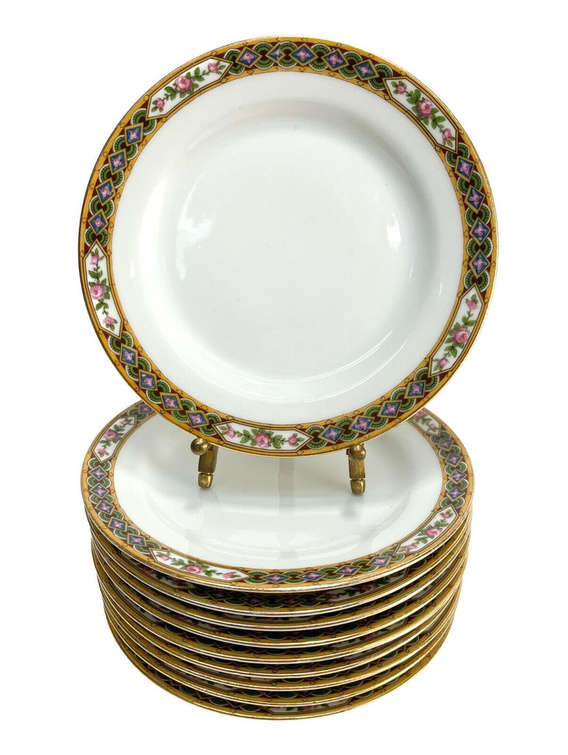 10 Jean Pouyat Limoges France Porcelain Bread Plates, circa 1900: 10 Jean Pouyat Limoges France porcelain bread and butter plates, circa 1900. Floral designs with geometric shapes to the rim. Marked Jean Pouyat Limoges to the underside. Weight: Approx. 3 lbs Measure