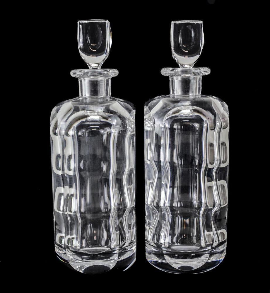 Pair of Sven Palmqvist Orrefors Modernist Art Glass Decanters 2508 cut panels: Pair of Vintage Modern Orrefors Modernist Art Glass Decanter 2508-111 Undulating effect with flat side panels. Signed on base. 8lbs Measurements: Approx. 10.5inches height x 3.25inches x 3.25inches Co