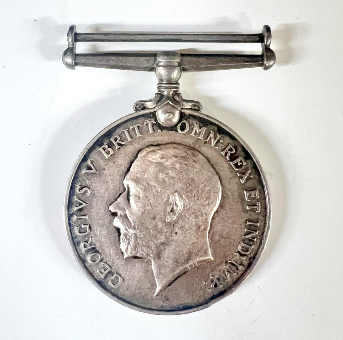 WWI Silver British War Medal 1914-18 George V: British WWI Silver War Medal 1914-18, George V; Awarded to Gunner George McGuire, Royal Artillery. Obverse sculpt by Bertram Mackennal of King George V facing left, legend "GEORGEIVS V BRITT: OMN: REX