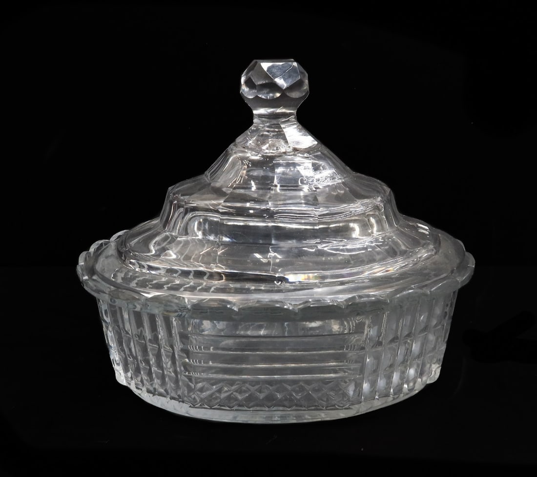 English Cut Glass Covered Oval Dish Circa 1850: English cut glass covered oval dish, circa 1850. Cut glass stripes and diamond designs throughout. Weight: Approx. 2 lbs Measurements: Approx. 7 inches x 5 inches x 6 inches tall Condition: Very good 