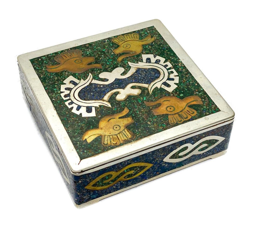 Mexico Alpaca Metal and Malachite and Lapis Stone Inlaid Square Box: Mexico Alpaca metal and stone inlaid square box. Lapis and malachite stone inlay to the lid and walls. Figural animal heads to the corners of the lid. Mexico Alpaca mark to the underside. Weight: Appr